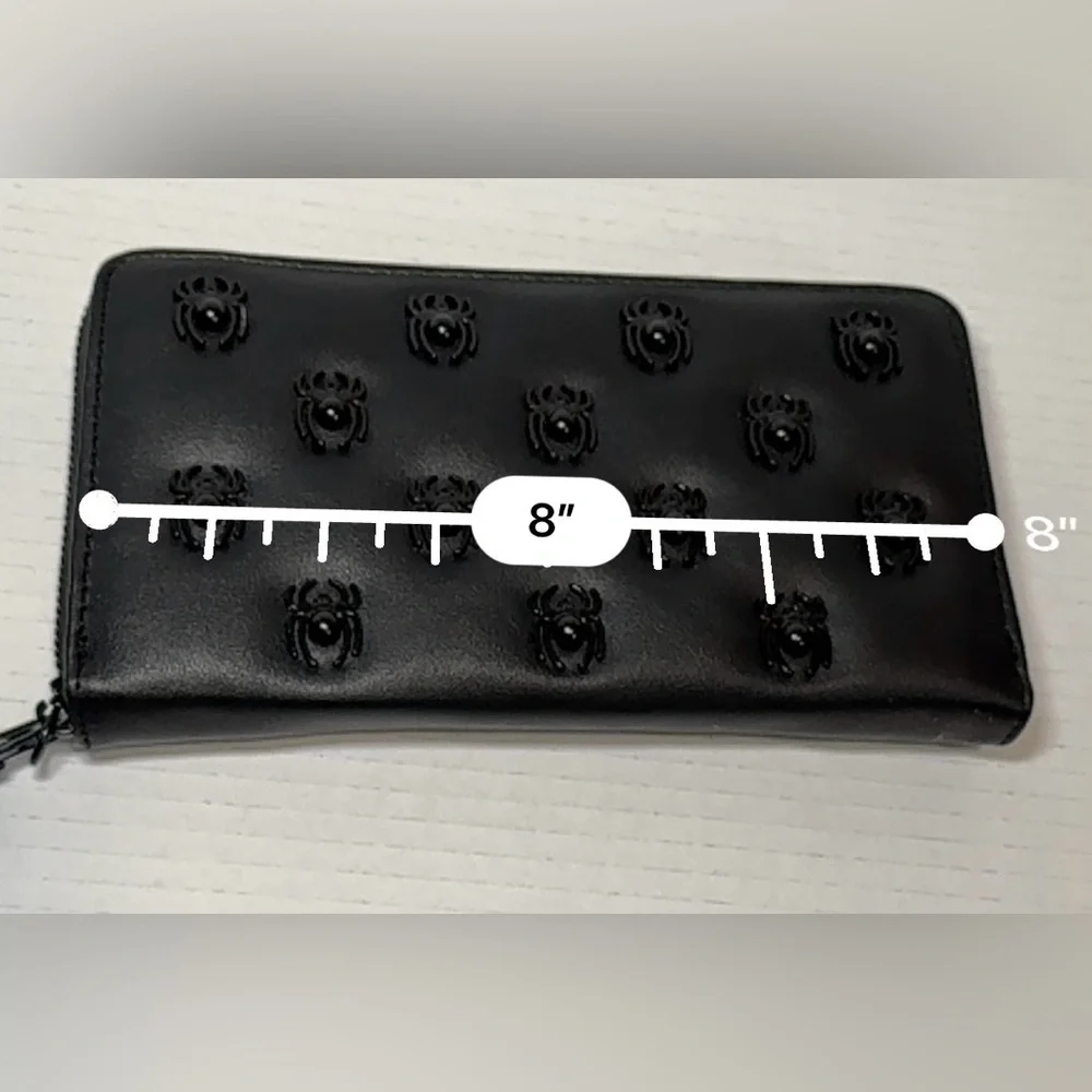 Betsey Johnson black faux leather zip-around wristlet/wallet